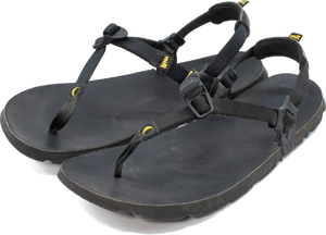 A pair of black LUNA sandals, cut out on a transparent background.