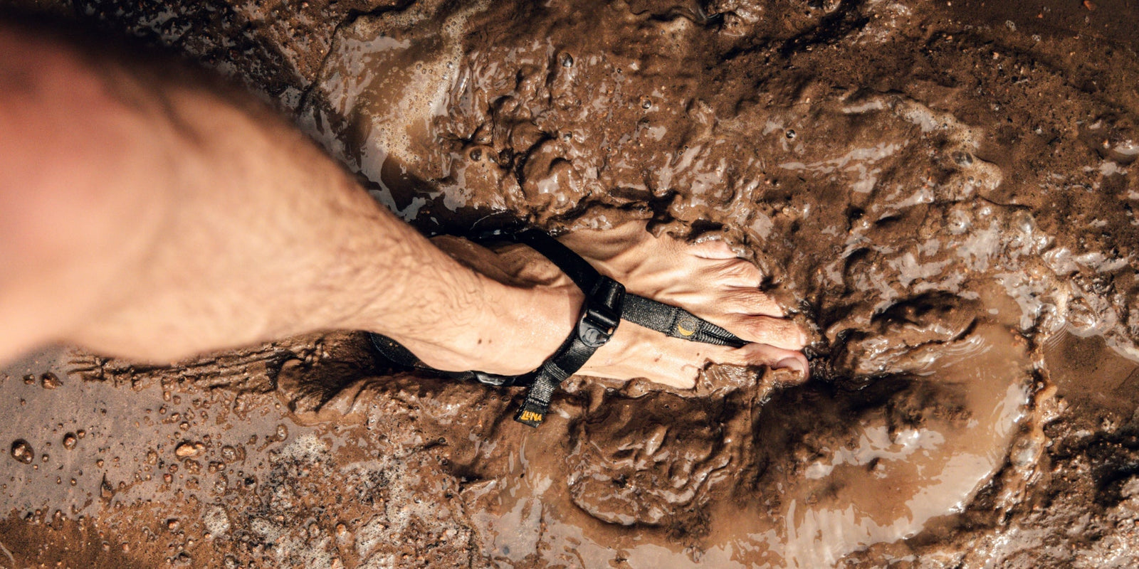 A human walks in mud in their LUNAs