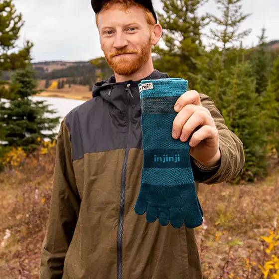 Injinji Toe Socks - Trail Midweight - holding the packaged pair