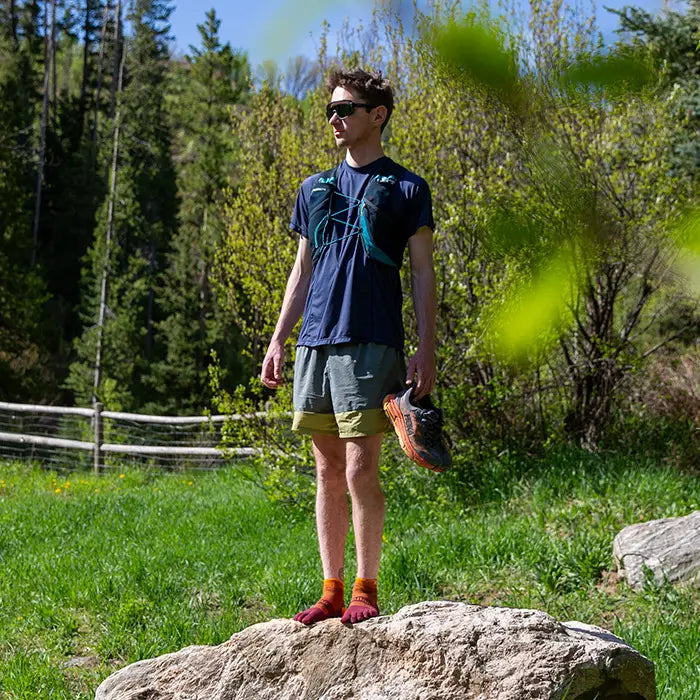 Injinji Toe Socks - Trail Midweight - standing on rock, trail