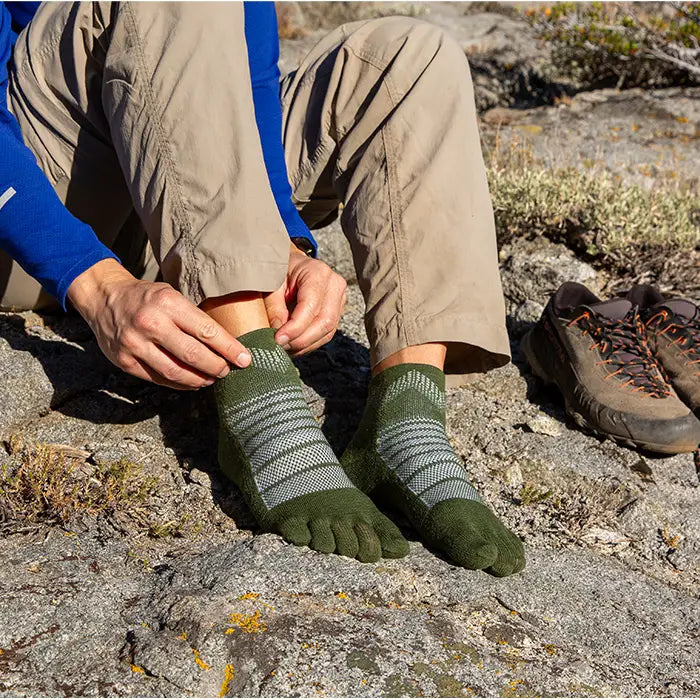 Injinji Toe Socks - Outdoor Midweight Wool - Forest - pulling on, trailside