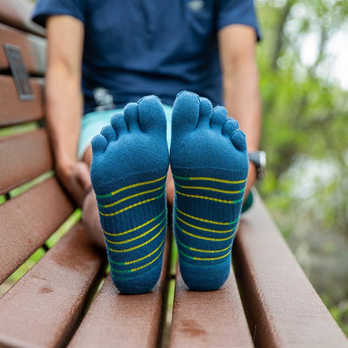 Injinji Toe Socks - Ultra Run Mini Crew - Poseidon - seated with knees up