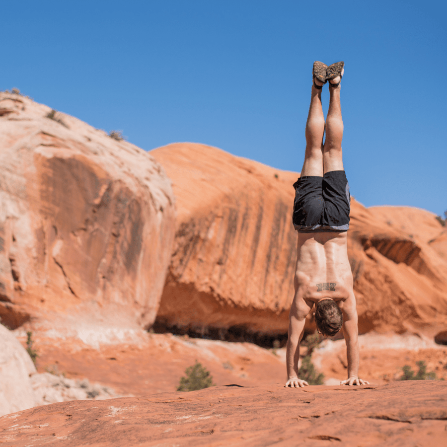 LUNAcycled Mono Winged Edition - Desert Canyon - handstand in the desert