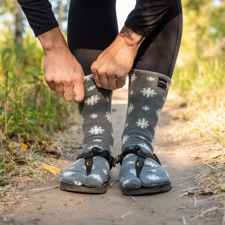 LUNA Polar Feet® Tabi Socks - pulling on, snowflake print