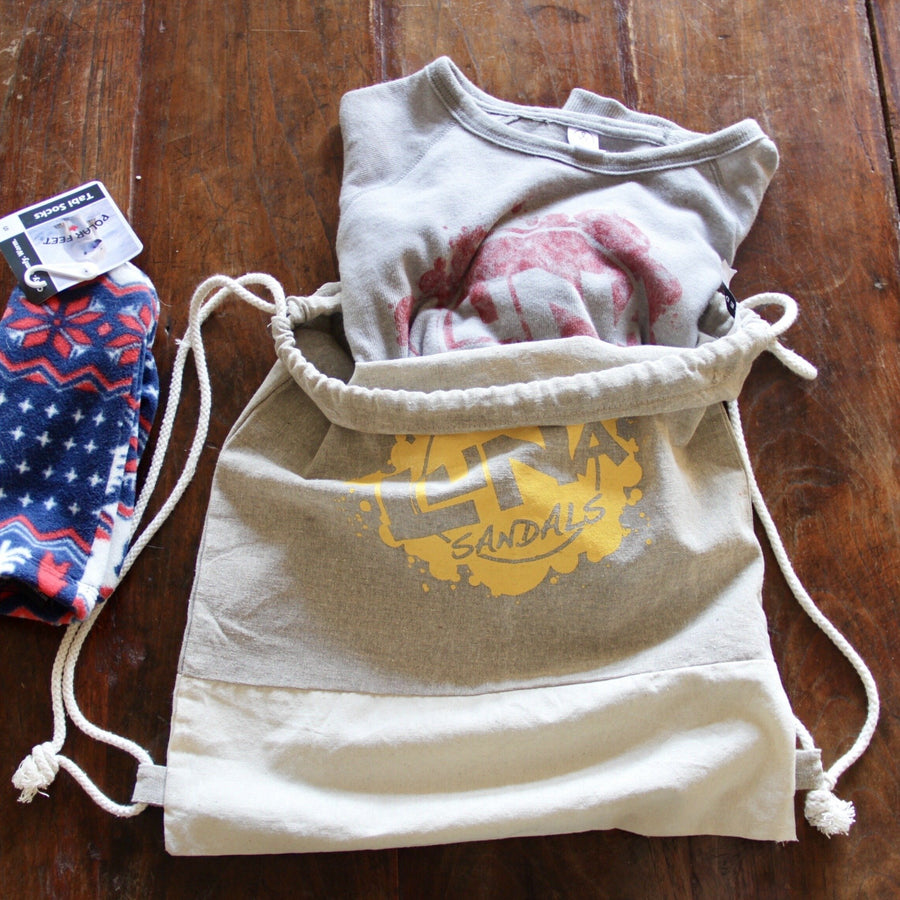 LUNA "Splash" Recycled Cotton Drawstring Backpack - flat with tee and socks